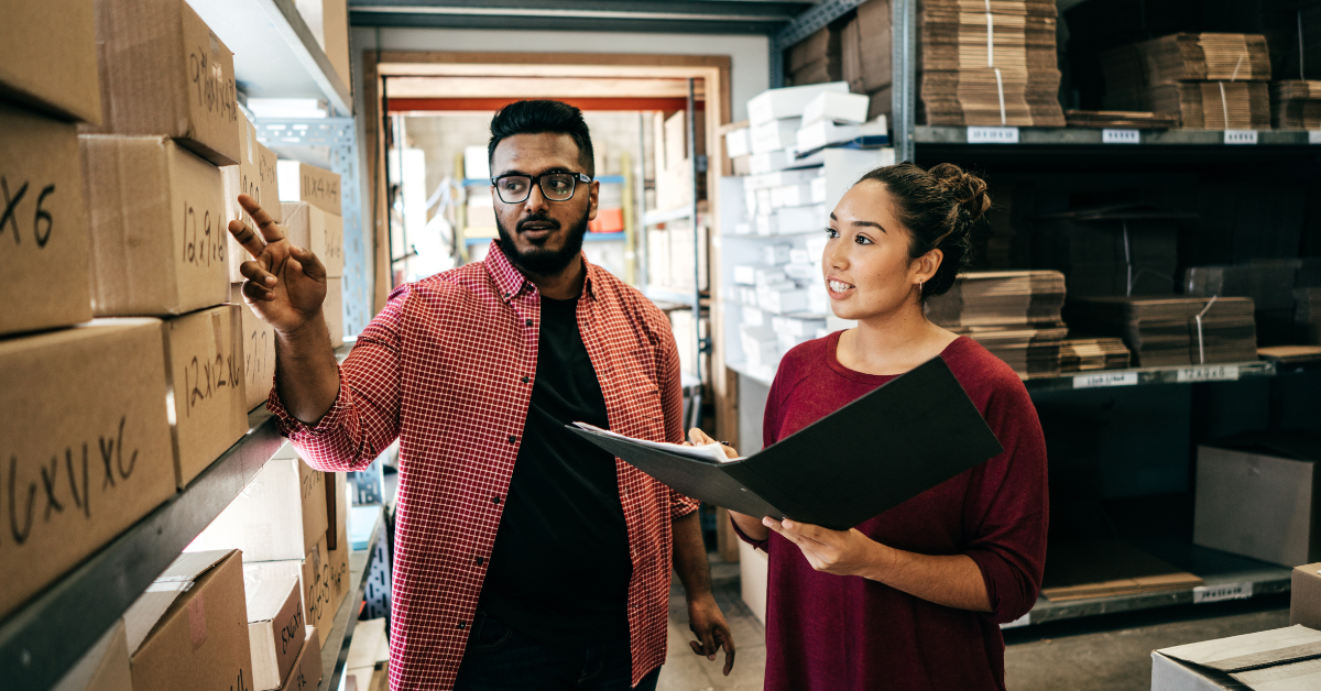 Two business owners doing inventory in a warehouse Two business owners doing inventory in a warehouse